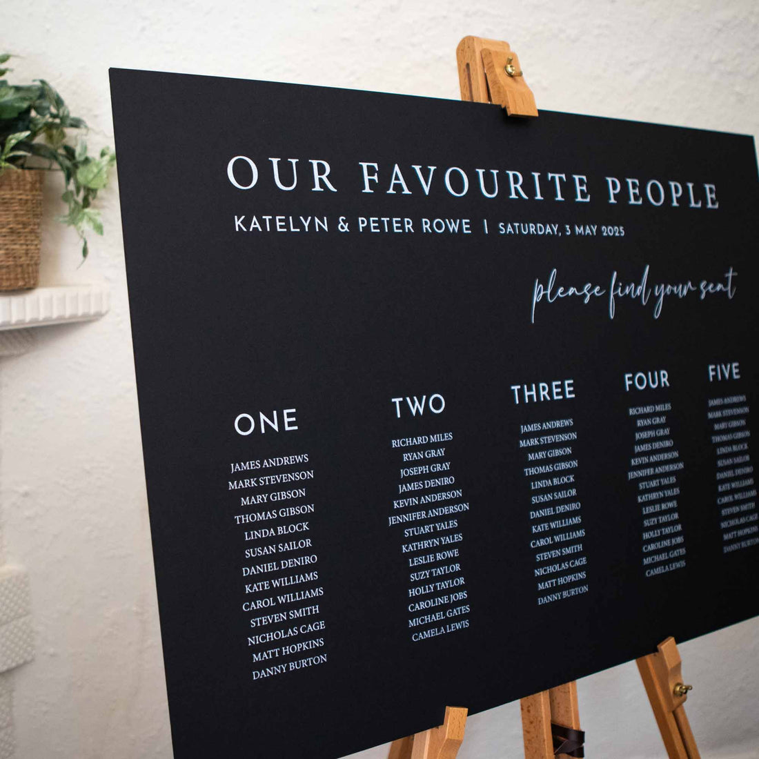 Personalised wedding seating chart in black foam board says our favaourite people