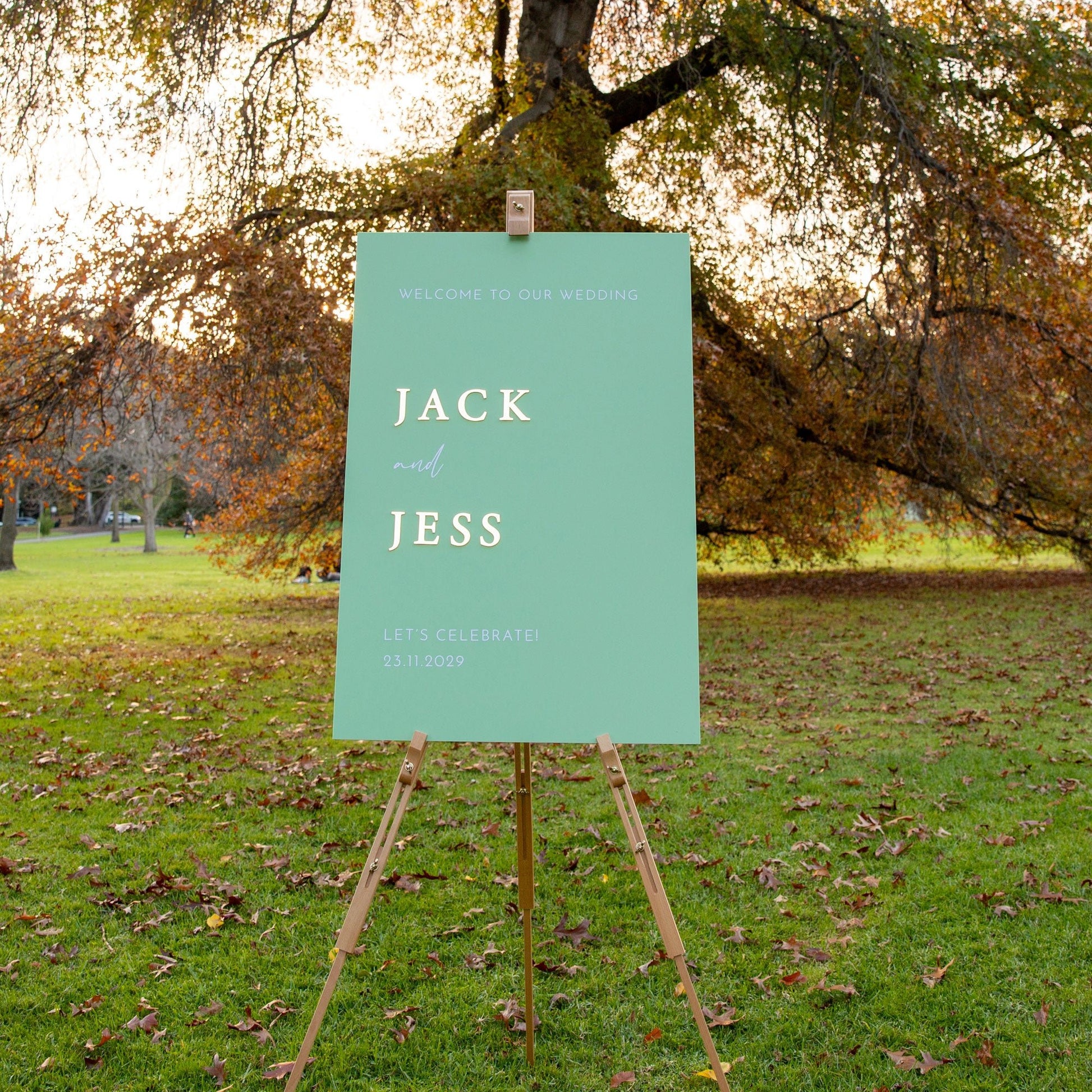 Personalised wedding sign in sage green with 3D gold names Jack and Jess, perfect for elegant outdoor weddings.