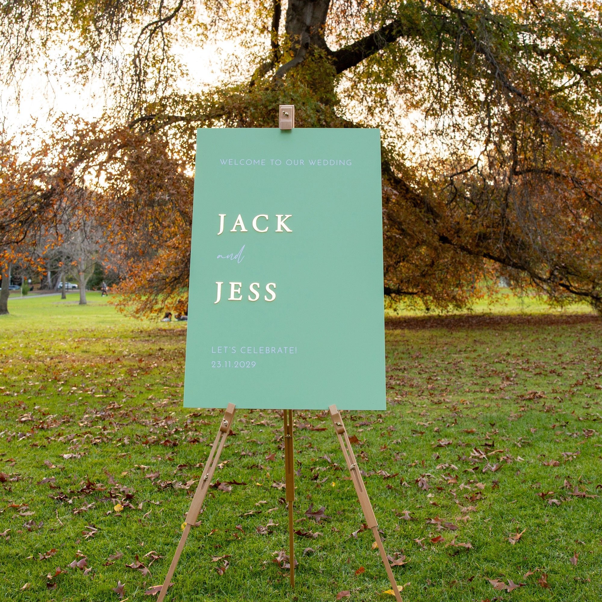 Personalised wedding sign in sage green with 3D gold names Jack and Jess, perfect for elegant outdoor weddings.
