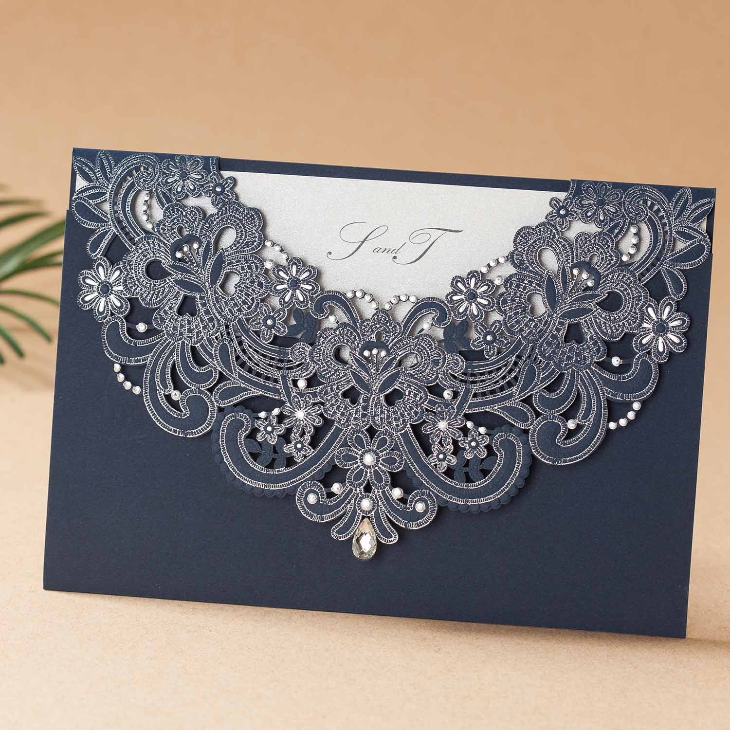 personalised laser cut wedding invitation with couple's monogram on top