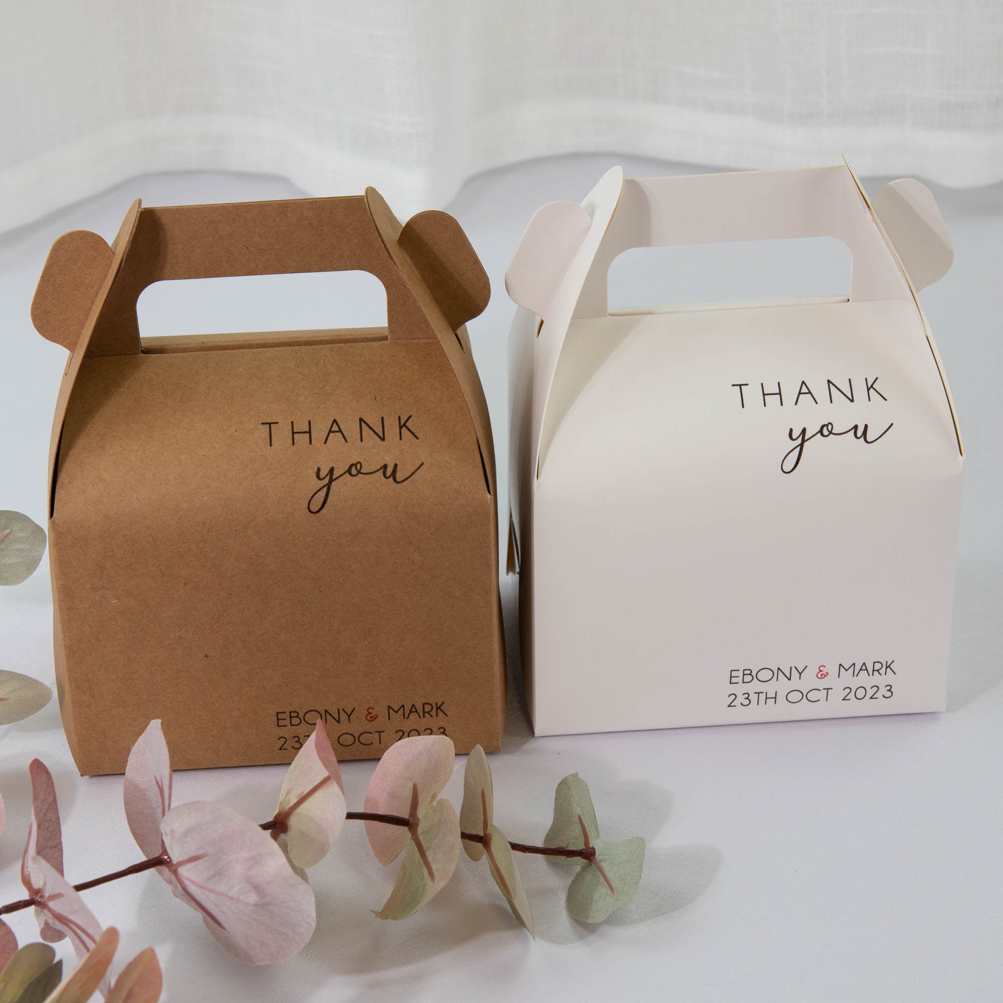 Personalised favour and cake box for wedding party. There are 2 colours, white and brown available and sample has writing as "THANK you" with the couple's name and the wedding date on it.