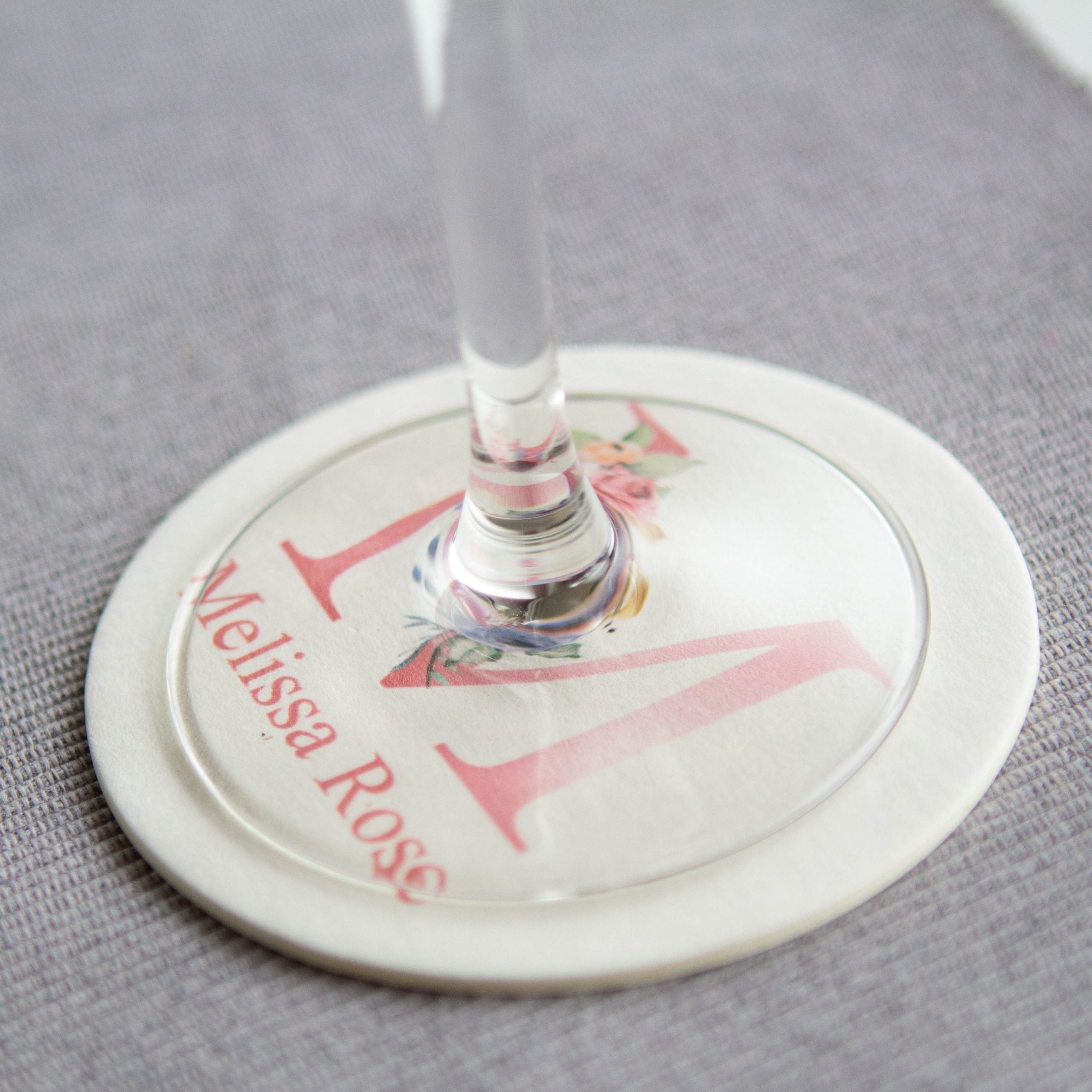 custom printed coaster with initial and name under wine glass