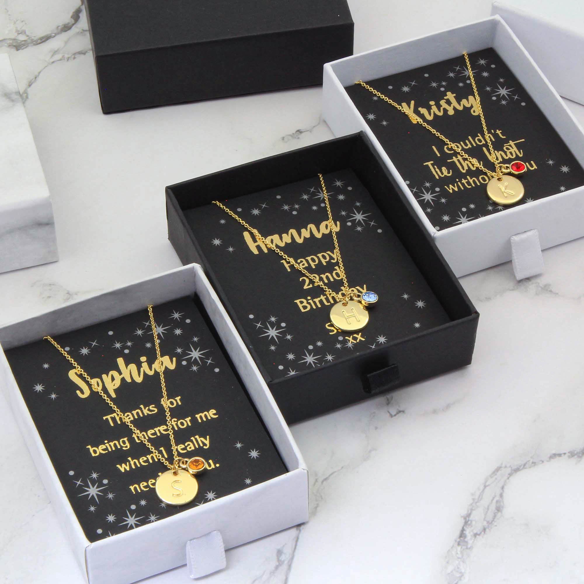 3 Initial & Birthstone Necklaces gold in white box